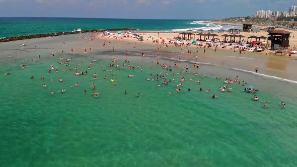 Surfers Surfing in Haifa Israel