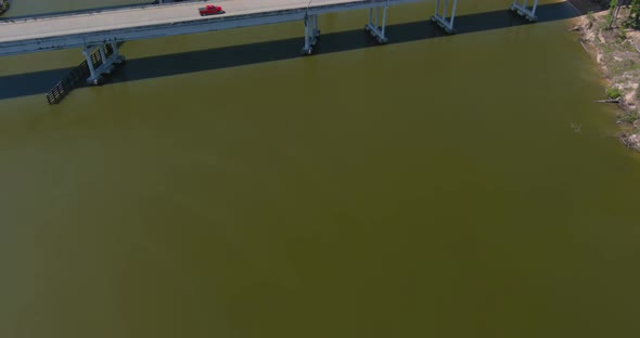 Aerial of cars driving on bridge that crosses over the San Jacinto River in Houston, Texas