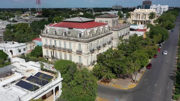 Aerial push in to the Casa Gemalas, twin houses along the Paseo de Montejo in Merida, Yucatan, Mexic