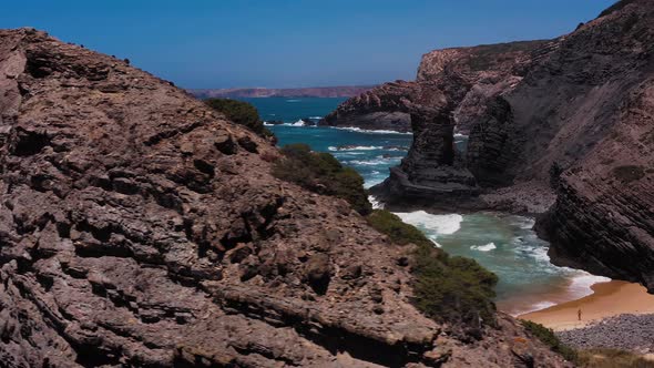 Rocky hilltop over empty beach