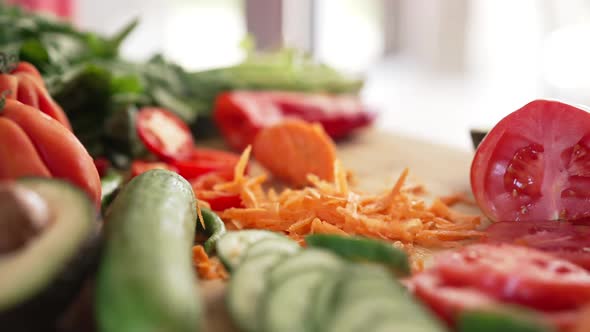 Closeup Salad Ingredients with Grated Carrot Falling in Slow Motion