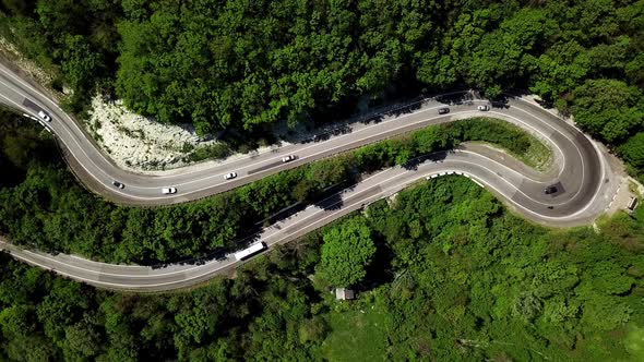 Top Down View From Above View of a Curved Winding Road Trough the Mountains