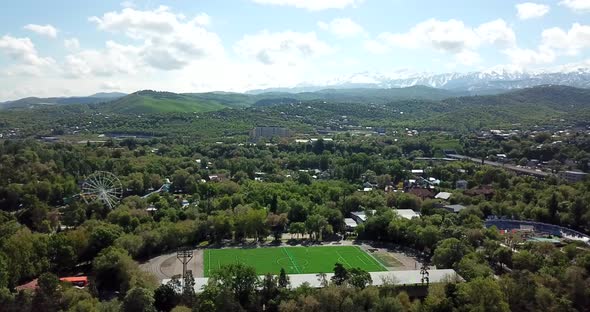 Green City with Snowy Mountains of Almaty