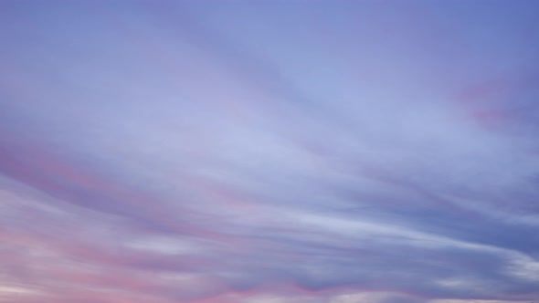 4K UHD : Time lapse of colorful sky during beautiful sunset. Romantic clouds.