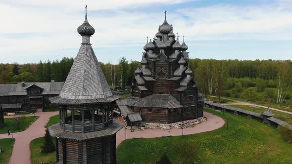 Old Wooden Temple Built Against Lush Green Trees in Forest alt