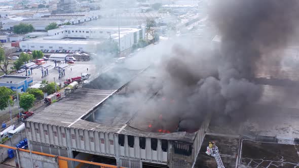 Collapsed Roof Of An Industrial Building Due To Massive Fire Burning. aerial