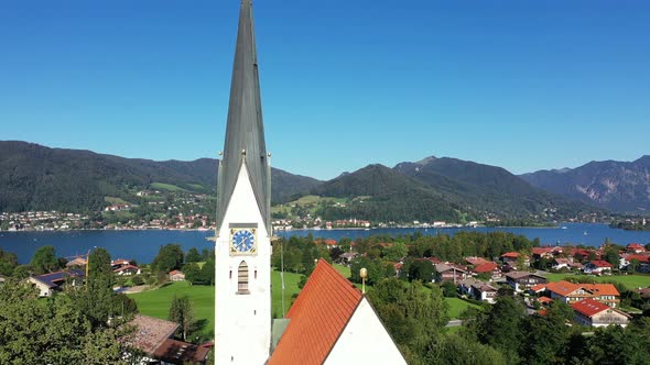 Aerial of lake Tegernsee and Maria Himmelfahrt parish church