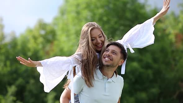 Young Couple Laughing And Having Fun Together On Nature