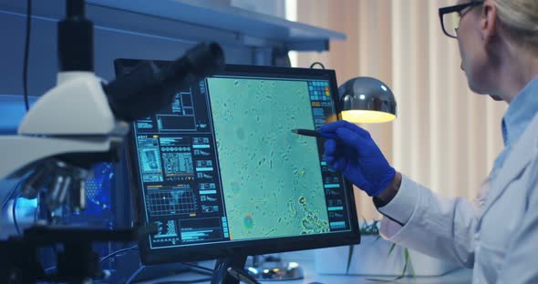 Scientist Using a Microscope in a Lab