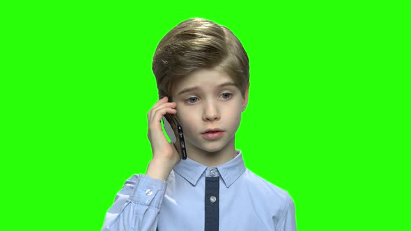 Toddler Boy Talking on the Phone with Parents