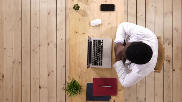 Afro American Doctor Working and Being Tired, Having Neck Pain