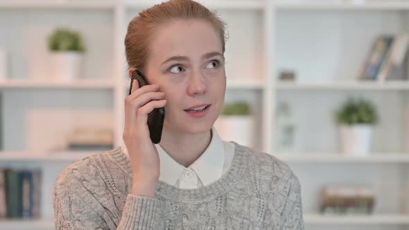 Portrait of Cheerful Young Woman Talking on Smartphone