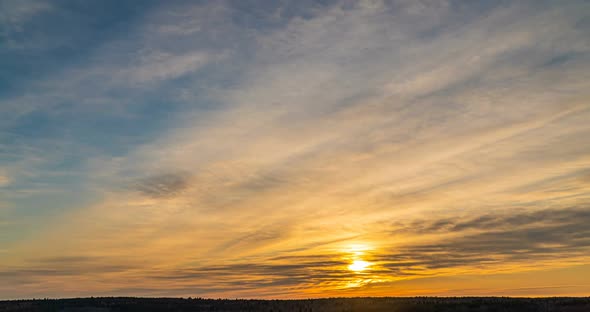 Beautiful Evening Sunset Time Lapse Movement of Clouds of a Different Level Against the Setting Sun