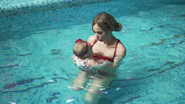 Mother with Her Baby in the Pool