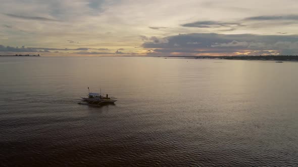 Aerial view of single filipino fishing boat near Lapu-Lapu city, Philippines.