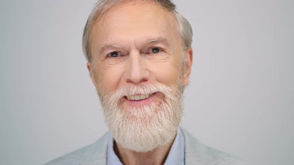 Joyful Man Looking to Camera Indoors