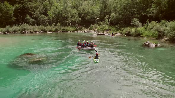 Aerial view of a group paddling in the rafting boat at the Soca River, Slovenia.