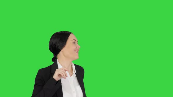 Excited Business Woman Dancing with a Bunch of Papers in Her Hand on a Green Screen, Chroma Key.