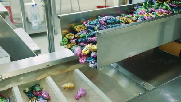 Candy Factory. Sweets Spilling From Conveyor.