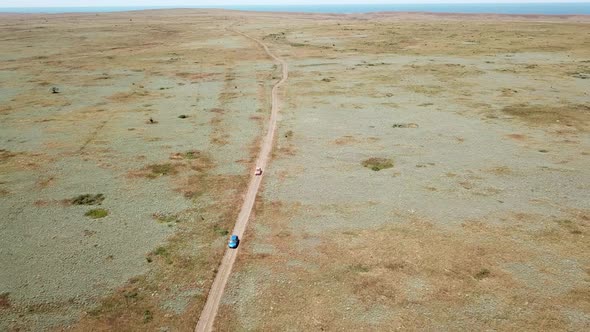 Aerial view. Cars go across the field. General's beaches, Crimea