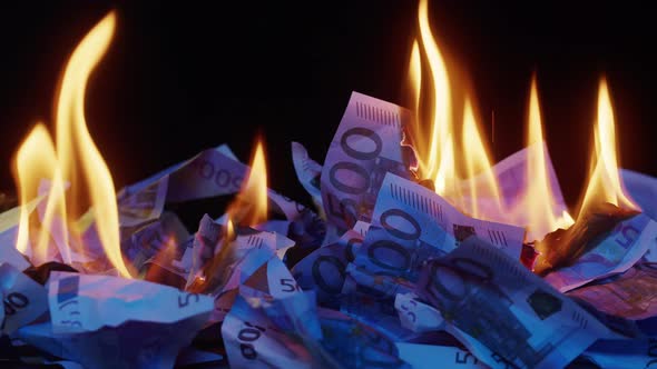 Burning of American 50 Dollar Banknotes on Black Background