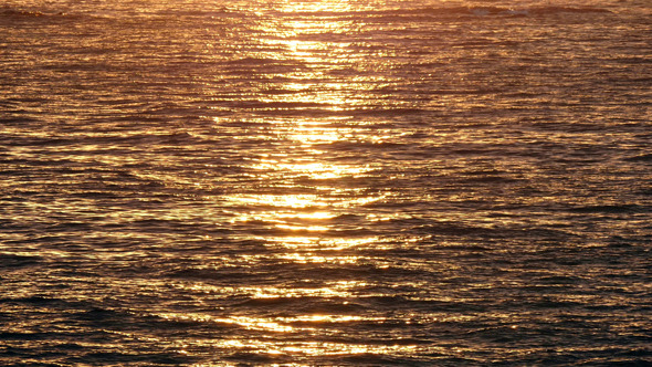Golden Waving Sea Waters at Sunrise