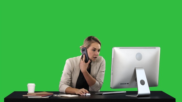 Beautiful happy smiling young office woman working on computer