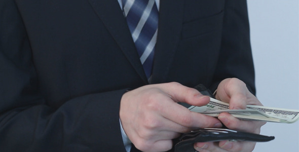 Businessman Counting Dollars