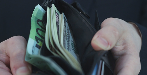 Businessman Showing Wallet with Money