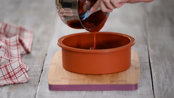 Pouring Cherry Jelly Into Silicone Mold.