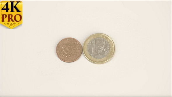 A Small Bronze France Coin and 1 Euro Coin