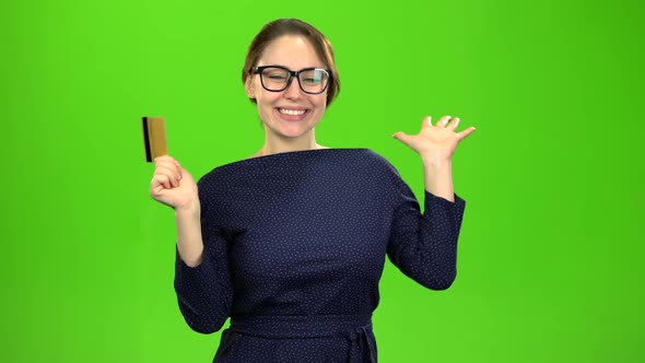 Girl Is Happy with the Money She Has on the Card. Green Screen