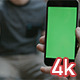 Guy Using Smartphone with Green Screen - VideoHive Item for Sale