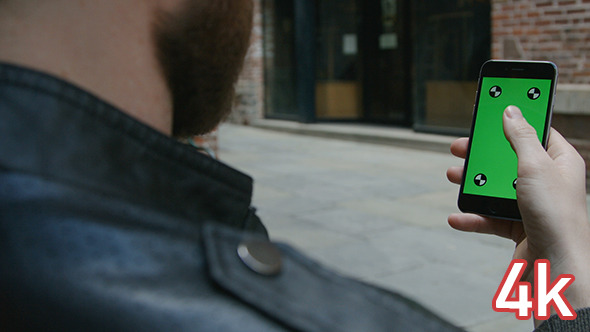 Guy Using Phone with Green Screen