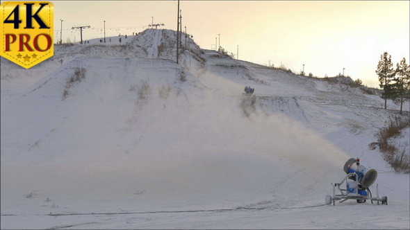 Two Snow Blowers on the Other Side of the Resort alt