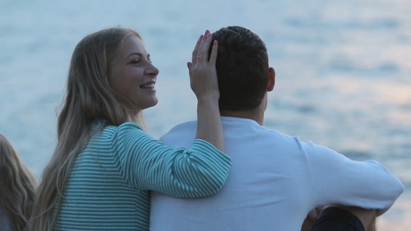 Wife Stroking And Kissing Her Husband While