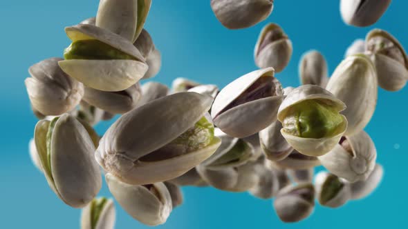 Flying of Pistachios in Sky Blue Background