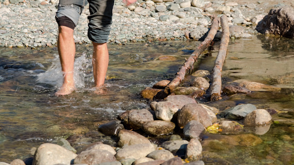 Man Passing Through the Mountain River alt