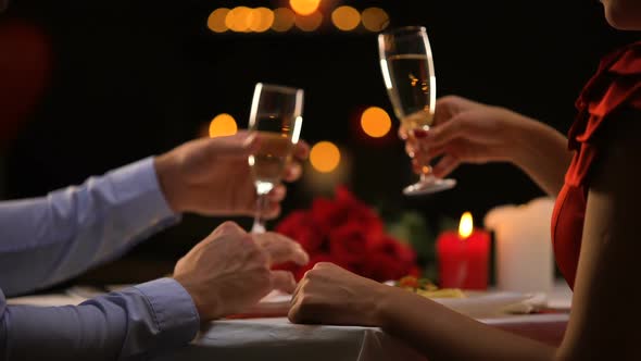 Couple Drinking Champagne, Male Stroking Lady Hand Tenderly, Romantic Evening