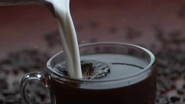 Cream pouring into coffee in slow motion; shot on Phantom Flex 4K at 1000 fps alt