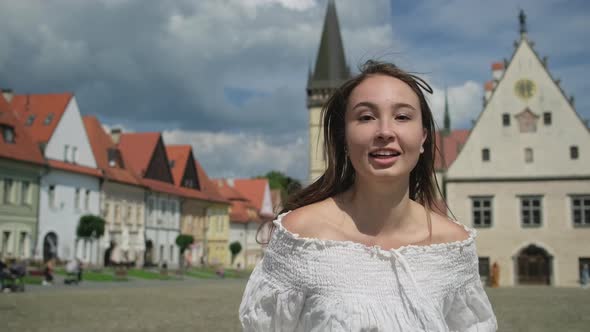 Happy Running Girl at Town Hall Square in Bardejov Slovakia