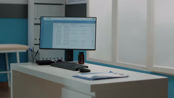 Close Up of Computer with Medical Files on Monitor