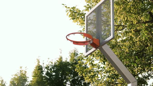 Old Basket on Basketball Playground Outdoors