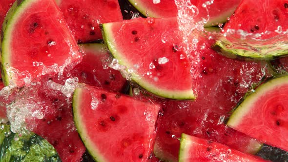 Super Slow Motion Shot of Splashing Water on Fresh Watermelon Slices at 1000Fps.