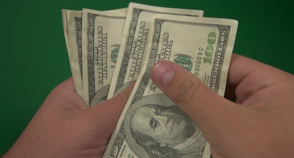 Dollars. American Money Close-up on a Green Background Hromakey . 100 Dollar Bills. One Hundred