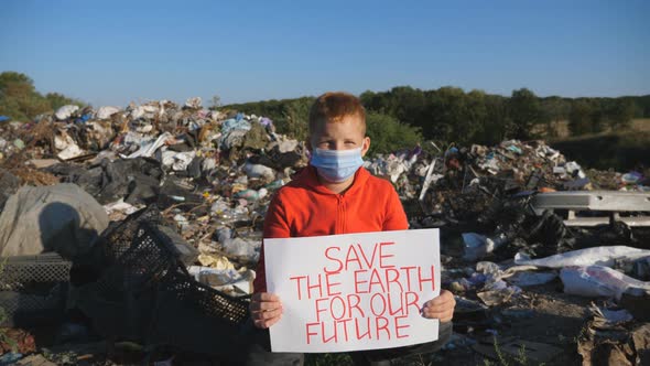 Portrait of Small Boy Holding in Hands Poster of Environmental Movement for Saving Planet