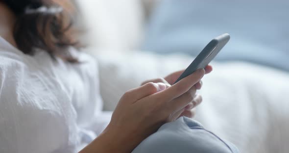 Asian woman use of smart phone at home