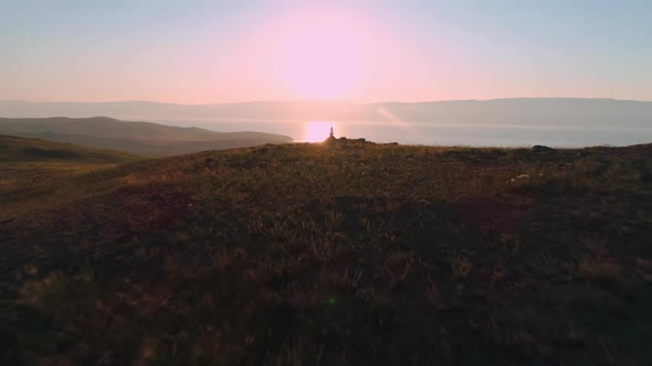 Aerial Field of Dry Yellow Grass. Steppe on Olkhon Island. Lake Baikal, Russia. Drone Footage Hills