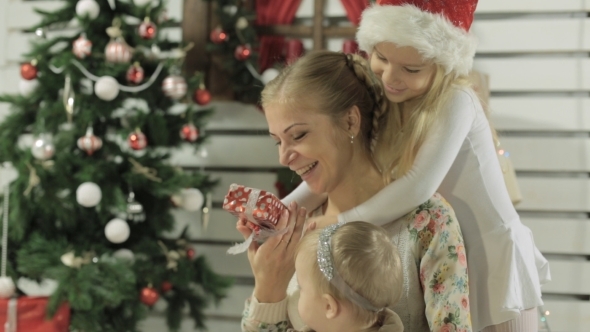 Young Mother Sitting With Baby Girl, Daughter