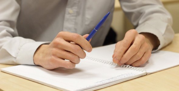 Student with a Pen at Lecture